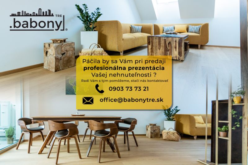 Living space with a wooden table on Okružná Street, suitable for residential land.