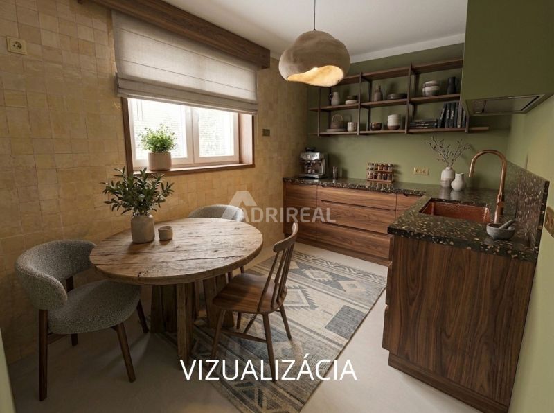 Kitchen in a 2-room apartment with wooden furniture and a round table.