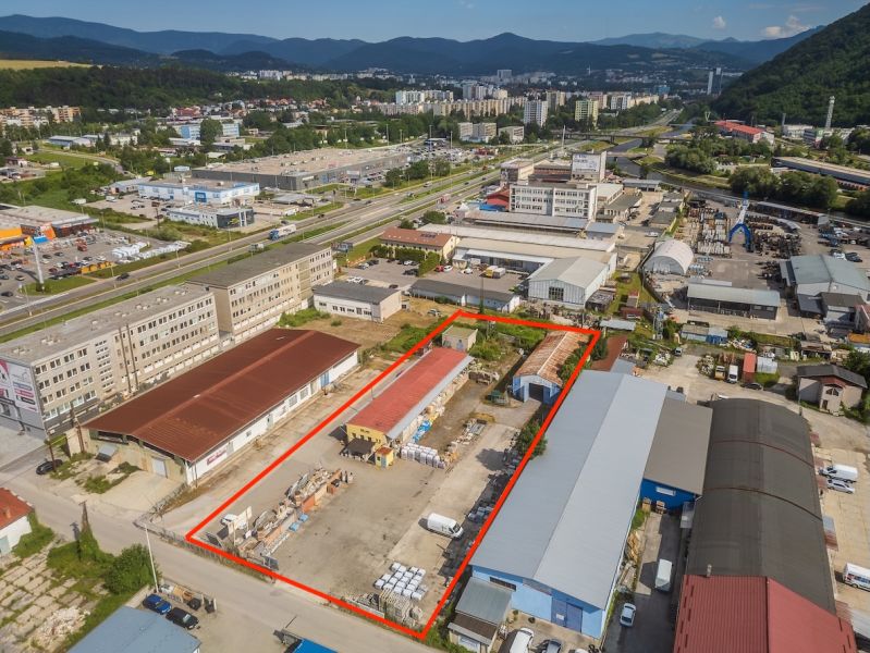 A building on Zvolenská Road in Banská Bystrica with industrial halls and warehouses.