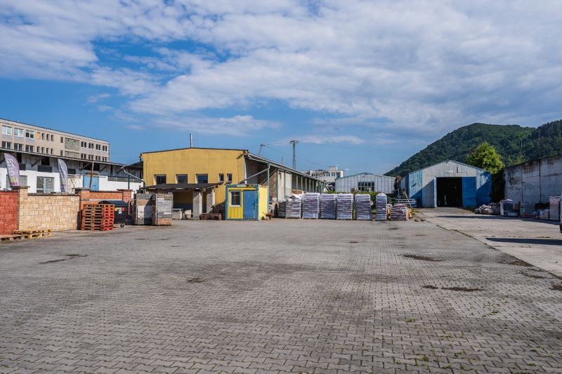 The area on Zvolenská Road in Banská Bystrica with buildings and storage facilities.