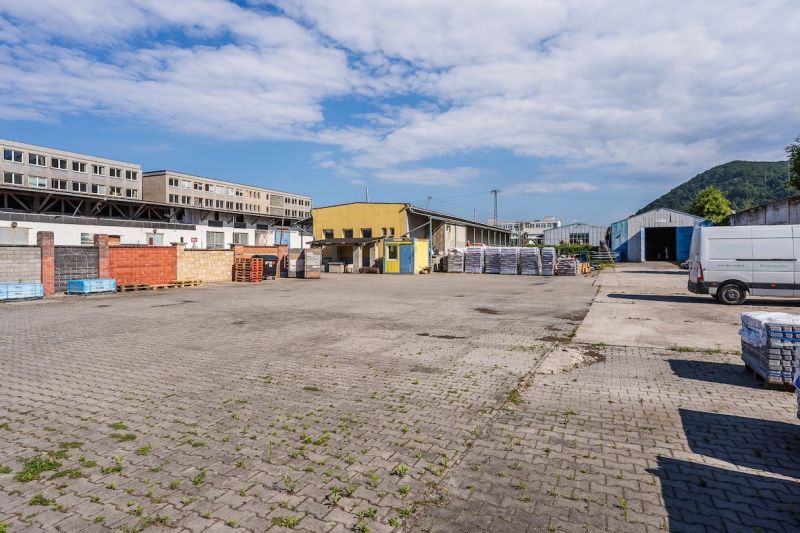 A building on Zvolenská Road in Banská Bystrica with an outdoor storage area and paving.