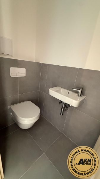 A small bathroom in a 3-room apartment with a toilet and a sink.