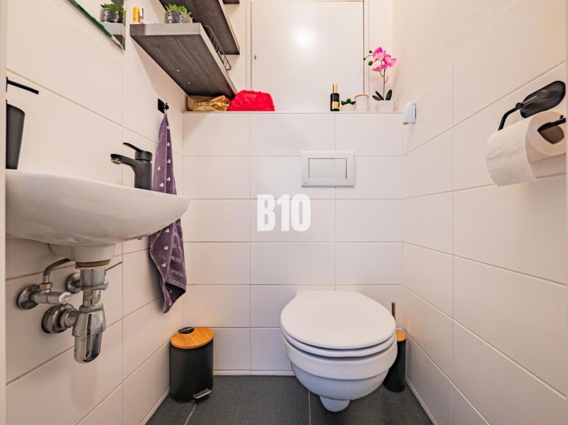 Bathroom in a 3-room apartment, practical shelf, subtle decoration, sanitary equipment.