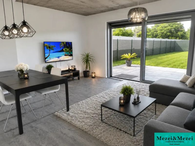 A living room in a family house with a wooden decor floor and a view of the garden.