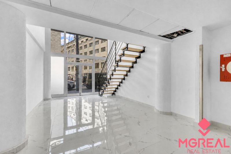 Commercial premises with a marble floor and staircase, creating an elegant appearance in the interior.