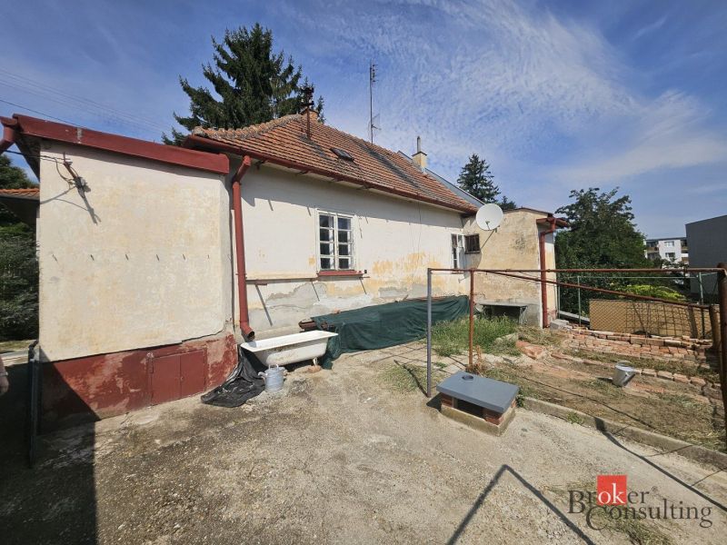A family house on Stračia Street in Nitra with rustic elements and a satellite dish.