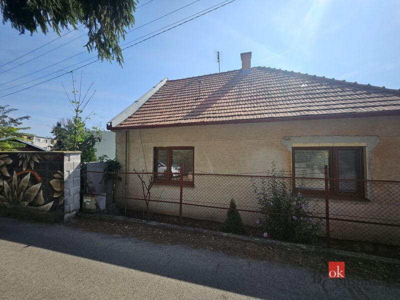 A family house on Stračia Street in Nitra with a white facade and a sloped roof.