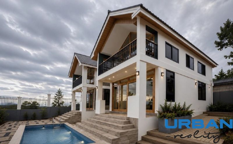 A family house in Pwani Mchangani with a pool, staircase, and wooden details.