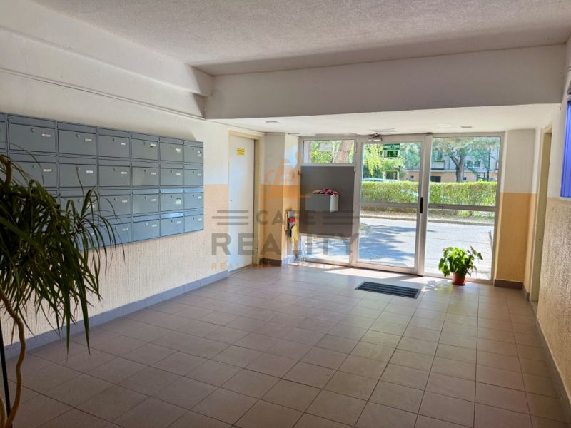 Entrance hall of the building with mailboxes and glass doors, 2-room apartment.