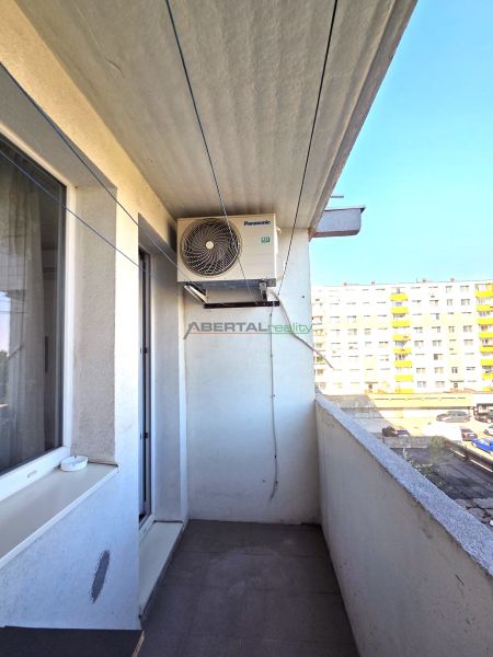The balcony of a 3-room apartment on Dudvážska Street in Bratislava, overlooking the neighboring buildings.