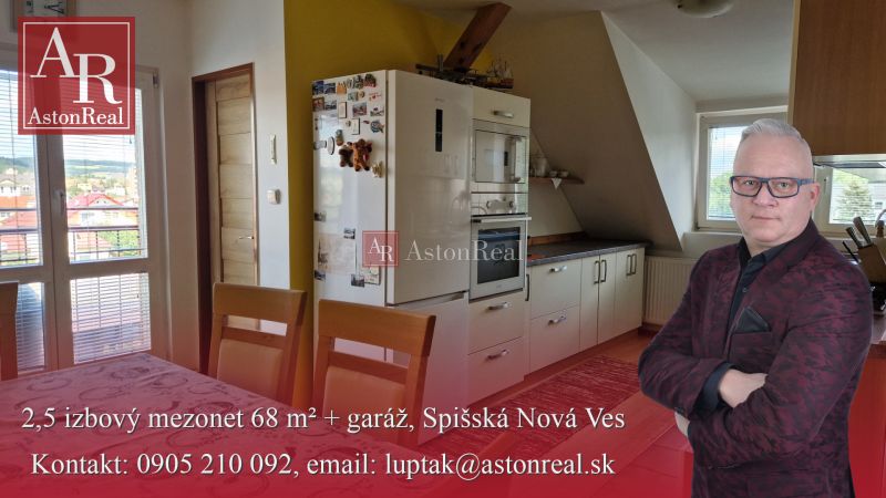 A kitchen in a 2-room apartment with a wooden decor floor and a dining table.