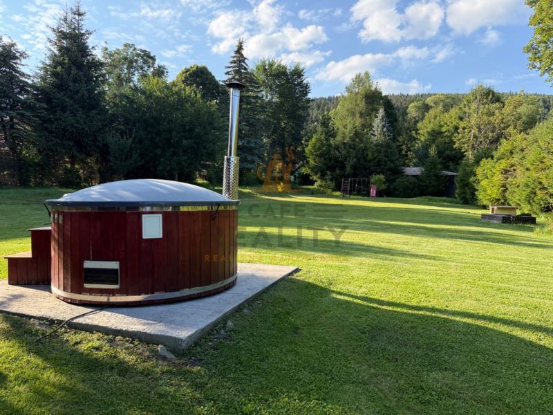A relaxing wooden tub in the garden of a family house on Jána Švermu Street in Šumiac.