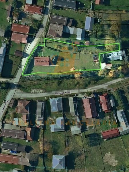 Aerial view of a wooden house with land on Jána Švermu Street in Šumiac.