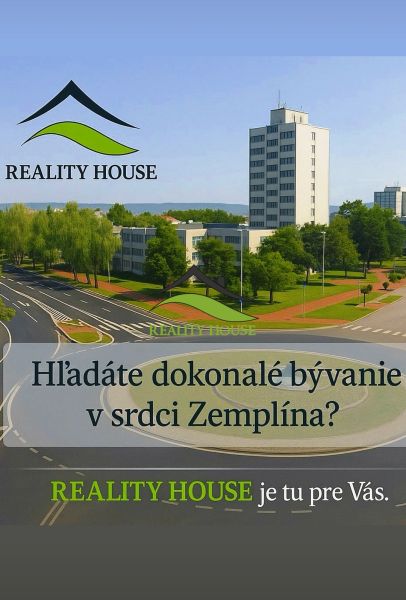 A building with a roundabout and greenery in the town of Michalovce.