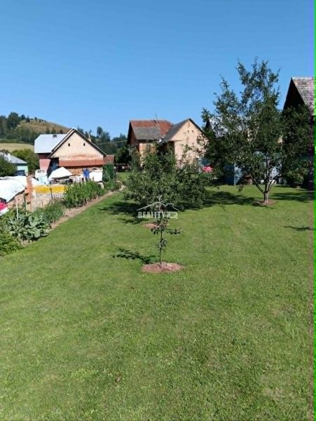 A garden with a lawn and fruit trees near houses in Ovčiarsko, Plots - living.