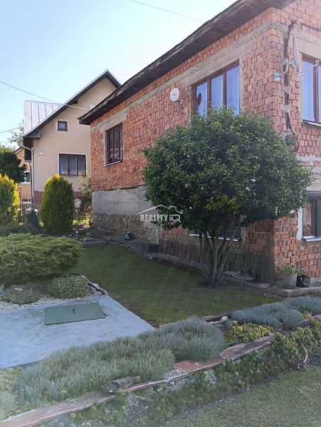 A family house in Ovčiarsko surrounded by greenery, suitable for residential land.