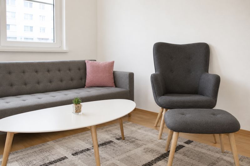 Living room with a comfortable sofa and an armchair in a 2-room apartment.