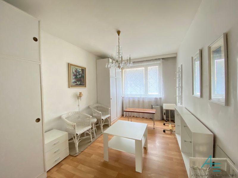 A room with light furniture and a floor with a wood decor, 4-room apartment.