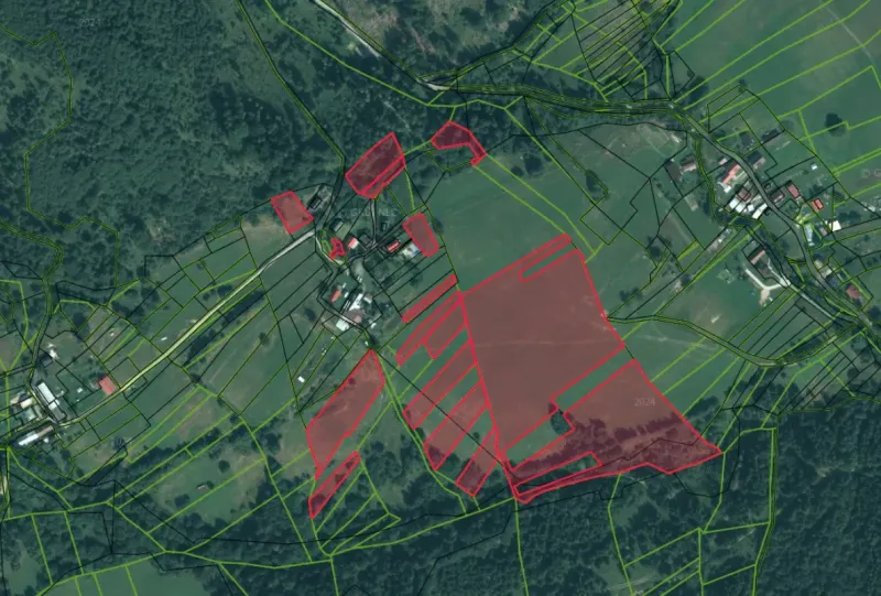 Orthophoto map of agricultural and forest lands around Nová Bystrica.