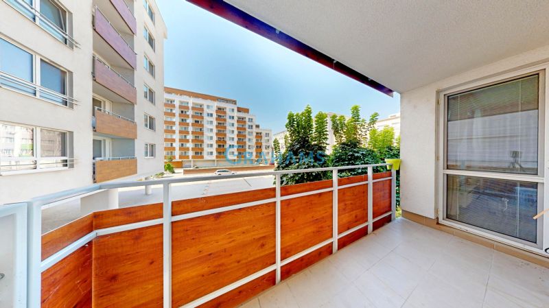 A balcony with wooden cladding in a 3-room apartment on Nobelova Street in Bratislava - Nové Mesto.