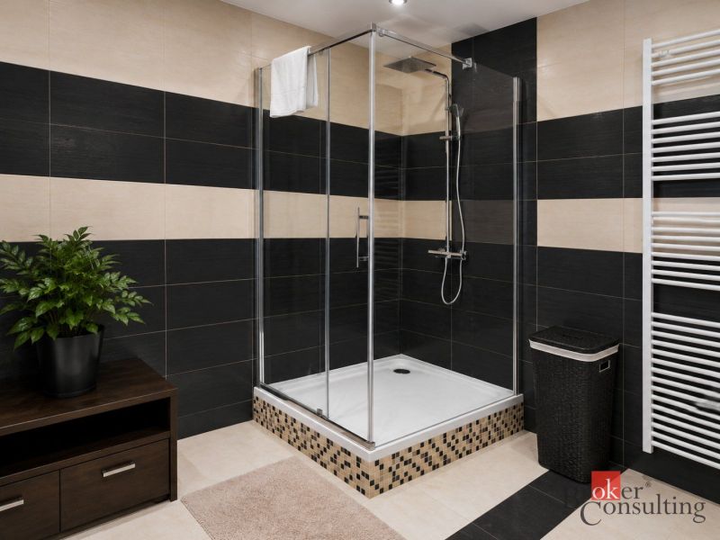 A bathroom in a family house with a modern shower and dark furniture.