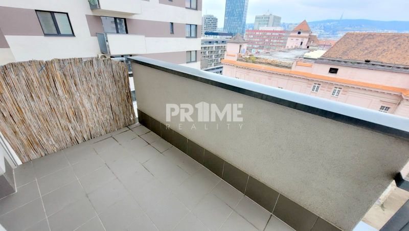 The balcony of a 2-room apartment with a view of the surrounding buildings in Bratislava - Ružinov, Jégého.