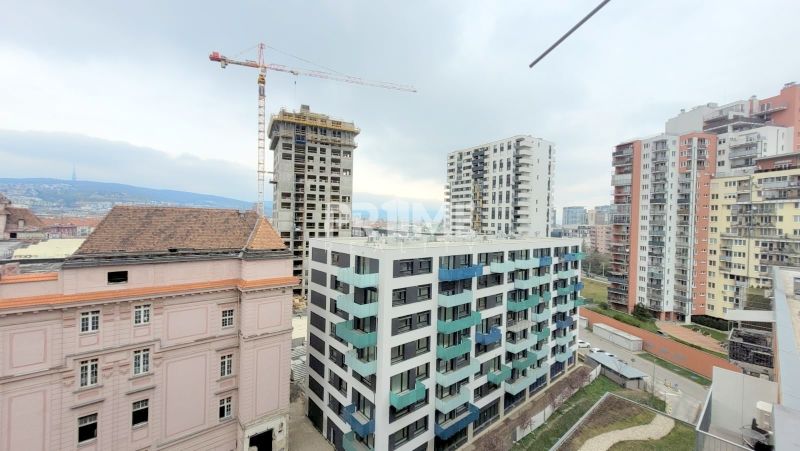 A view of the construction of residential buildings and a crane on Jégého Street in Bratislava - Ružinov.