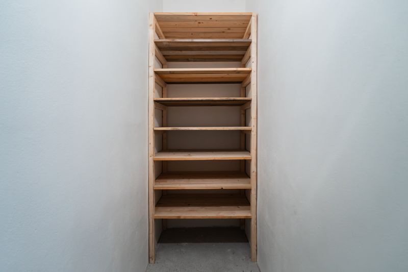 Wooden shelf in a narrow room, typical for a 2-room apartment.
