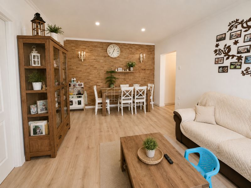 Interior of a 3-room apartment with a wooden decor floor and white furniture.