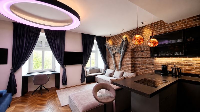 Stylish 1-bedroom apartment with a brick wall, wood-patterned flooring, and modern lighting.