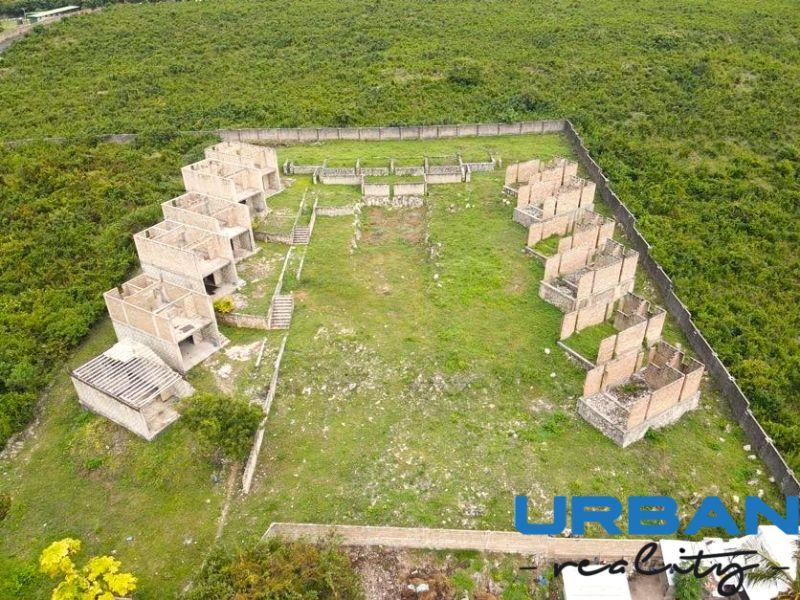 Vacant buildings and green spaces in the commercial area of Matemwe, Unguja North East.
