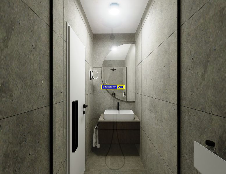 Bathroom in a 3-room apartment with a sink, mirror, and gray walls.
