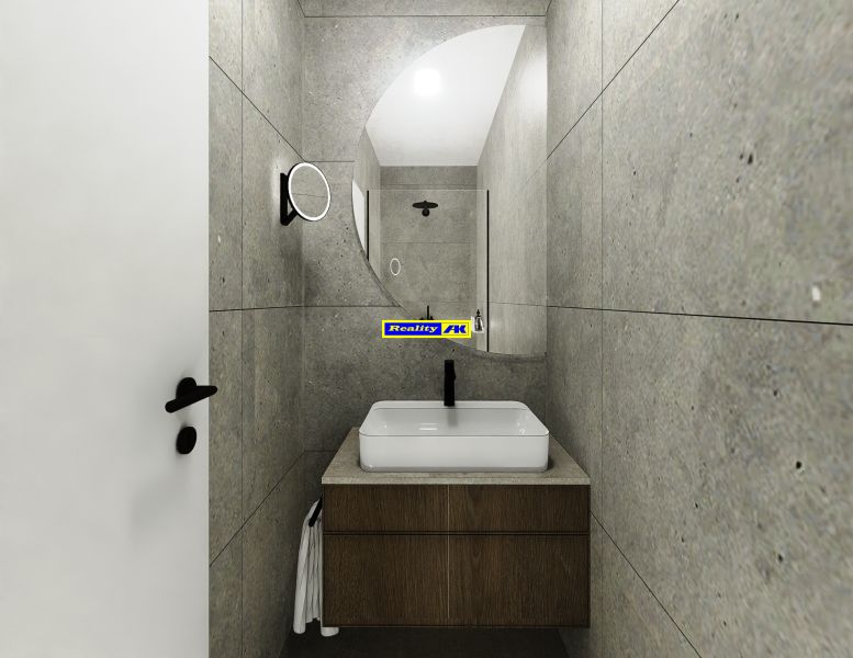 Bathroom with a sink on a wooden cabinet and gray tiles in a 3-room apartment.