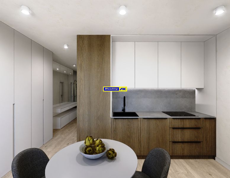 Kitchen area in a 3-room apartment with a wooden decor floor and white cabinets.