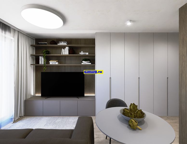Living room with TV and built-in wardrobes in a 3-room apartment.