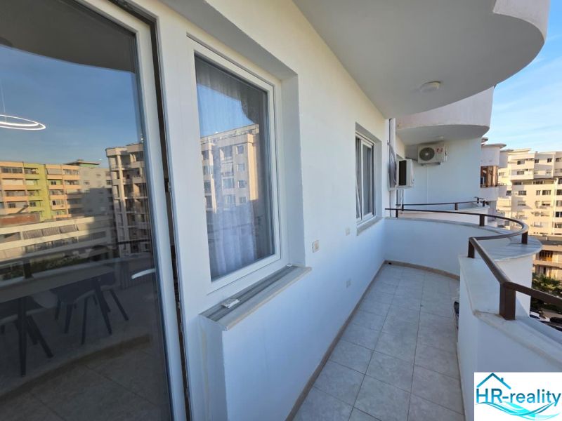A balcony with a railing adjoins a 2-room apartment in the city of Drač.