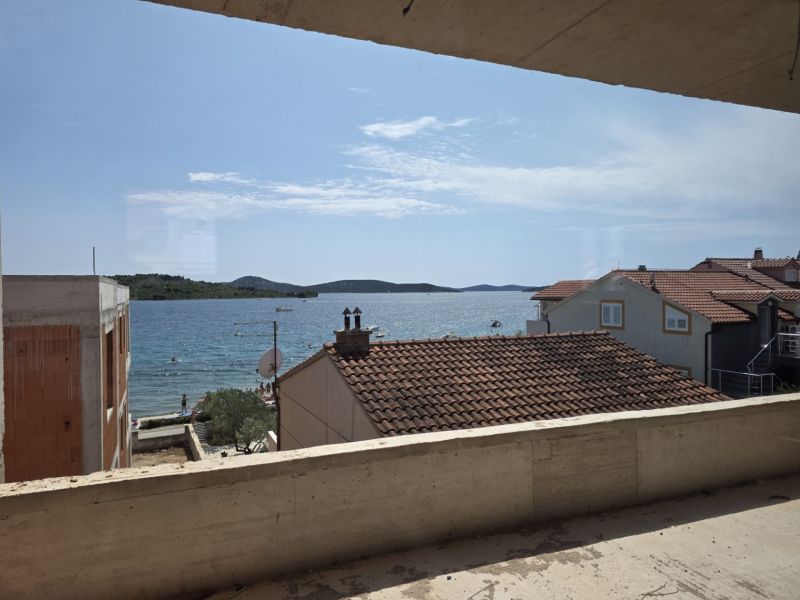 View from a 3-bedroom apartment in Srima of the sea and the beach under the yellow house.