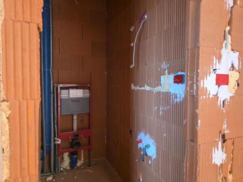 Bathroom installation in a 3-room apartment, prepared space for the toilet.