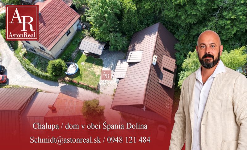 Aerial view of a cottage in Špania Dolina, Banská Bystrica, surrounded by greenery.
