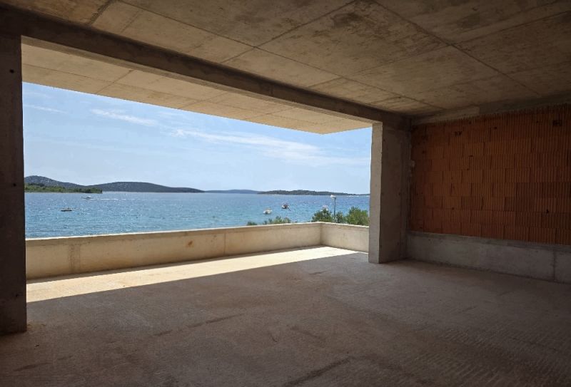 View from a 4-room apartment in SRIMA to the sea through a large window.