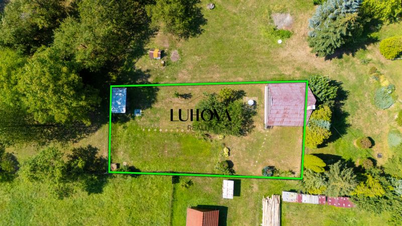 A cottage on Dubková Street in Lazy pod Makytou with a large grassy plot and trees.