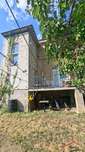 A family house on Levická Street in Vráble with a veranda and a garden.