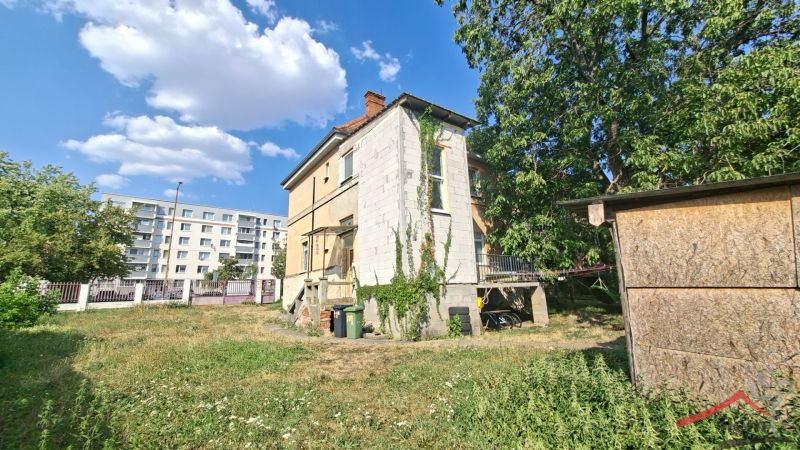 A family house on Levická Street in Vráble, surrounded by greenery and lawn.