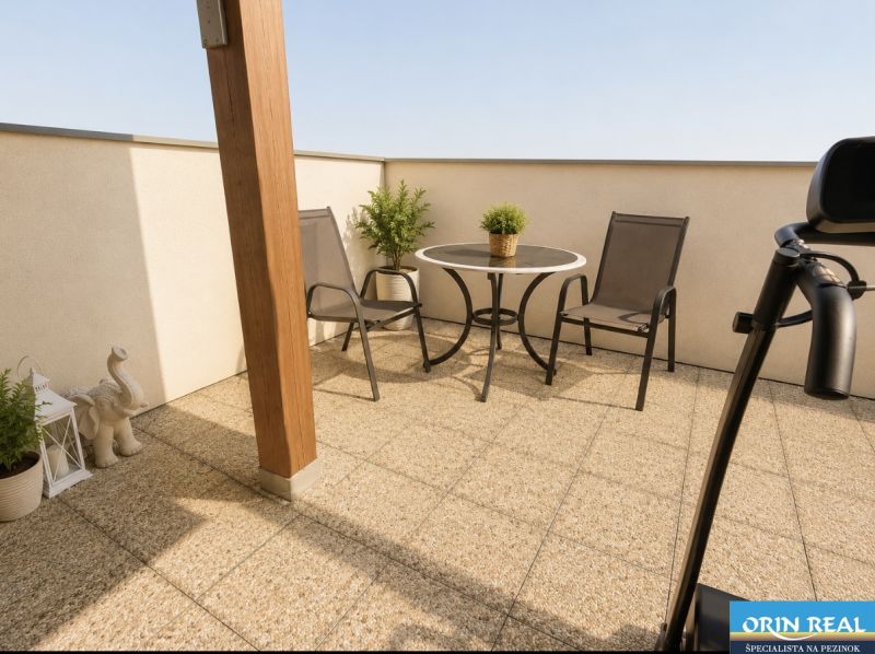 Terrace of a 1-bedroom apartment with a view from Čerešňová Street, Chorvátsky Grob, and garden furniture.