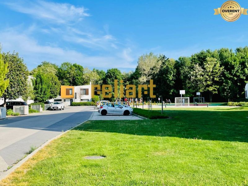 A peaceful area with greenery and a playground on Žltá Street in Bratislava - Petržalka.