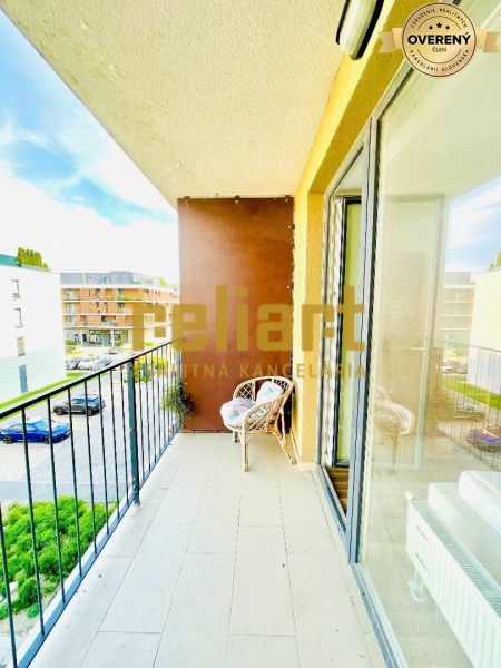 Balcony of a 1-room apartment on Žltá Street, Bratislava - Petržalka, with seating and a view.