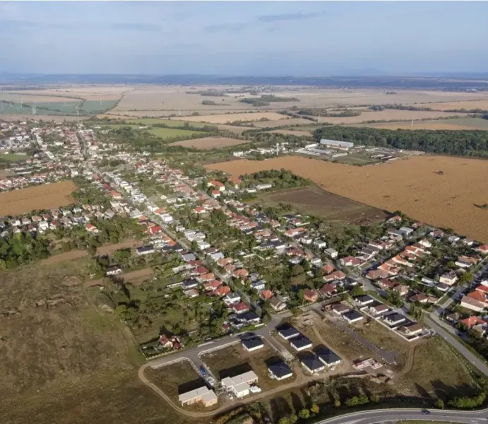 Aerial view of agricultural and forest land in Križovany nad Dudváhom with the village.