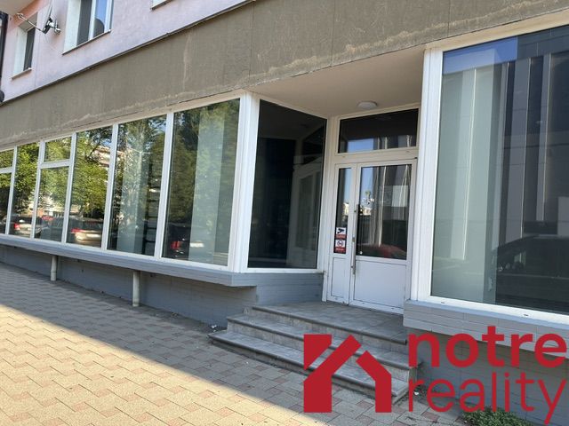 Offices on Ľudovíta Štúra Street, Lučenec, with large glass display windows.