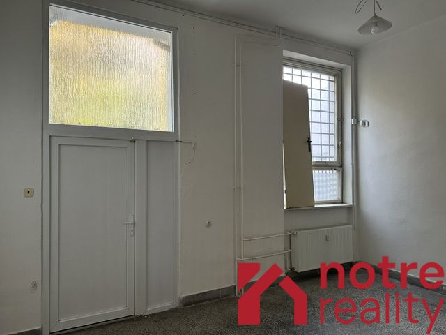 White walls and glass doors create bright offices.