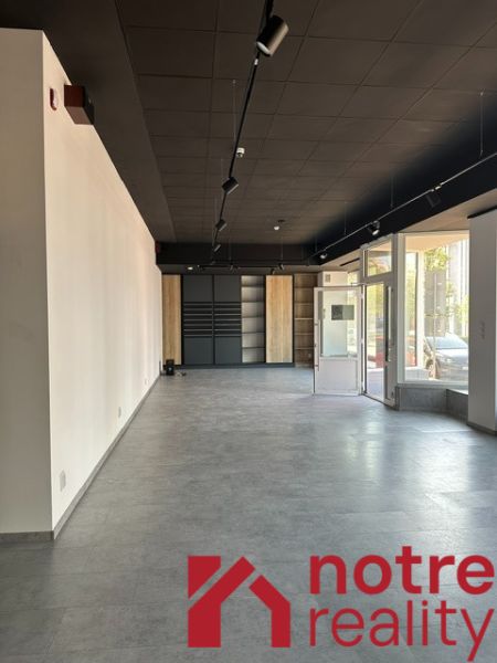 Spacious offices with large windows and decorative flooring.